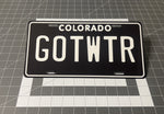 Custom black and white license plate