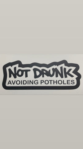 NOT DRUNK AVOIDING POTHOLES