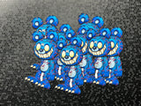 Scary blue teddy bear with red veins popping out sticker